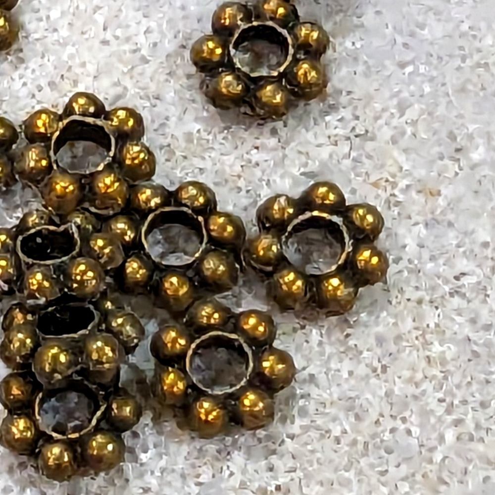 Jewelry makers bronze over silver 6 mm spacer beads. 500 quantity